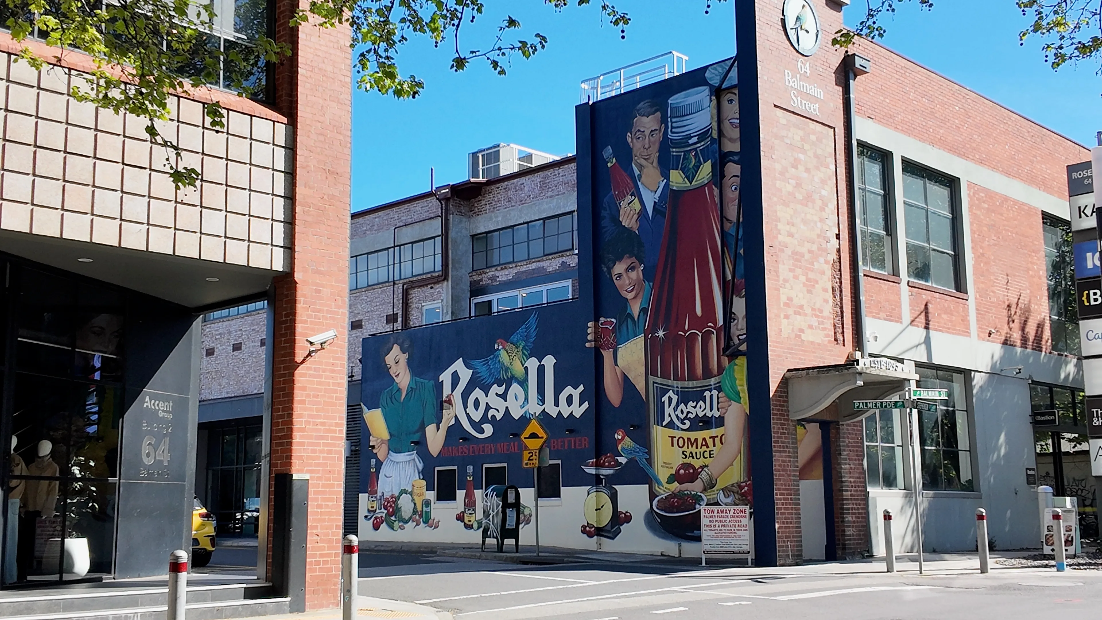 A vintage Rosella tomato sauce mural on the side of a brick building.