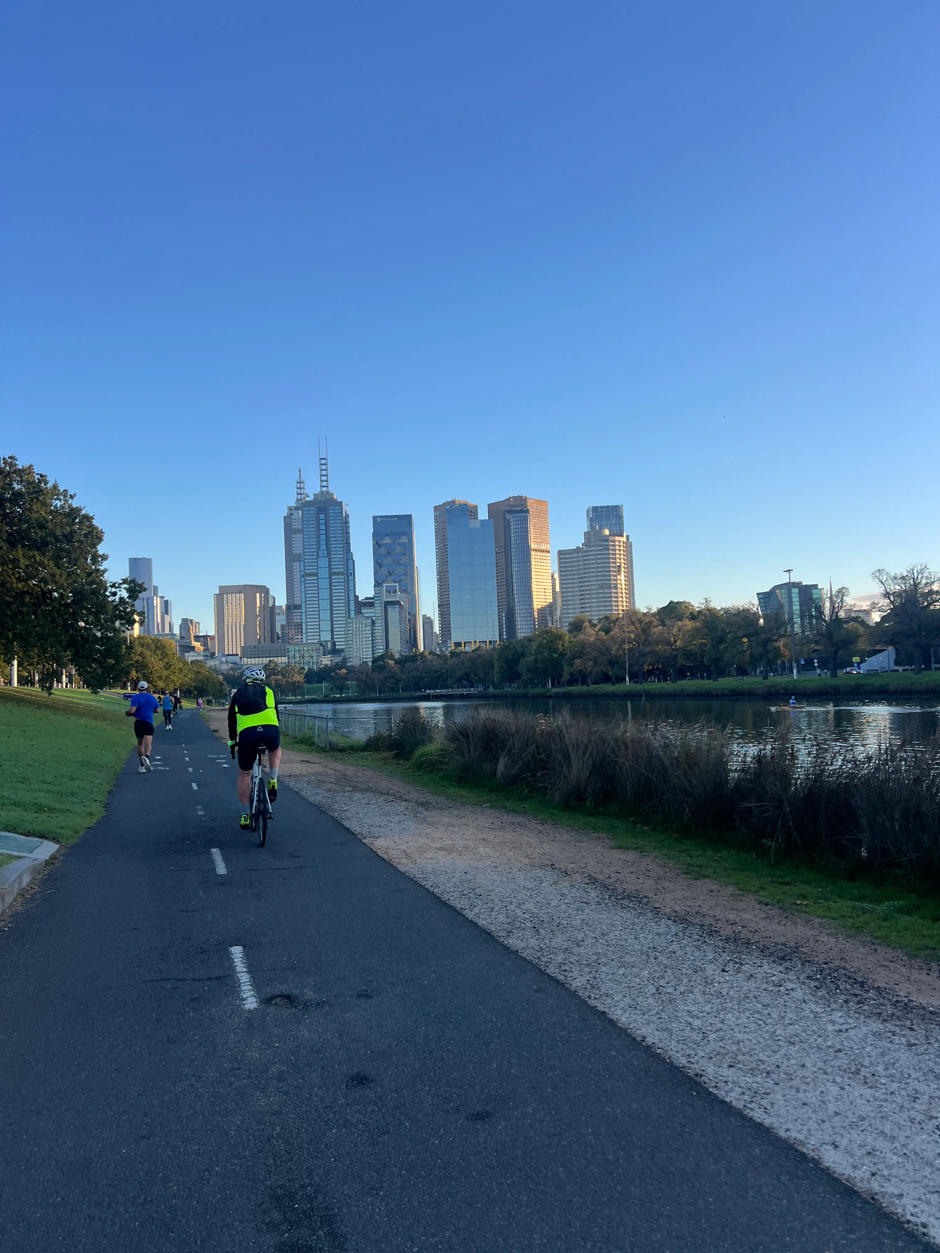 A bike path leading toward the CBD towers.