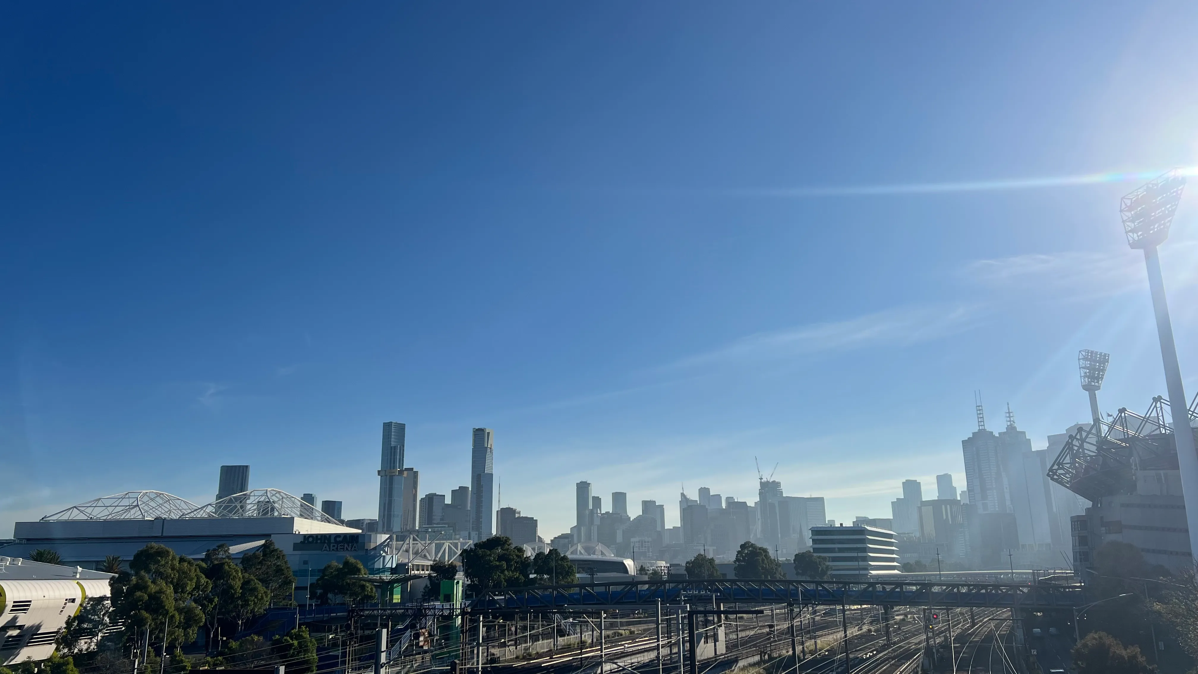 The CBD skyline rising beyond the rail yards.