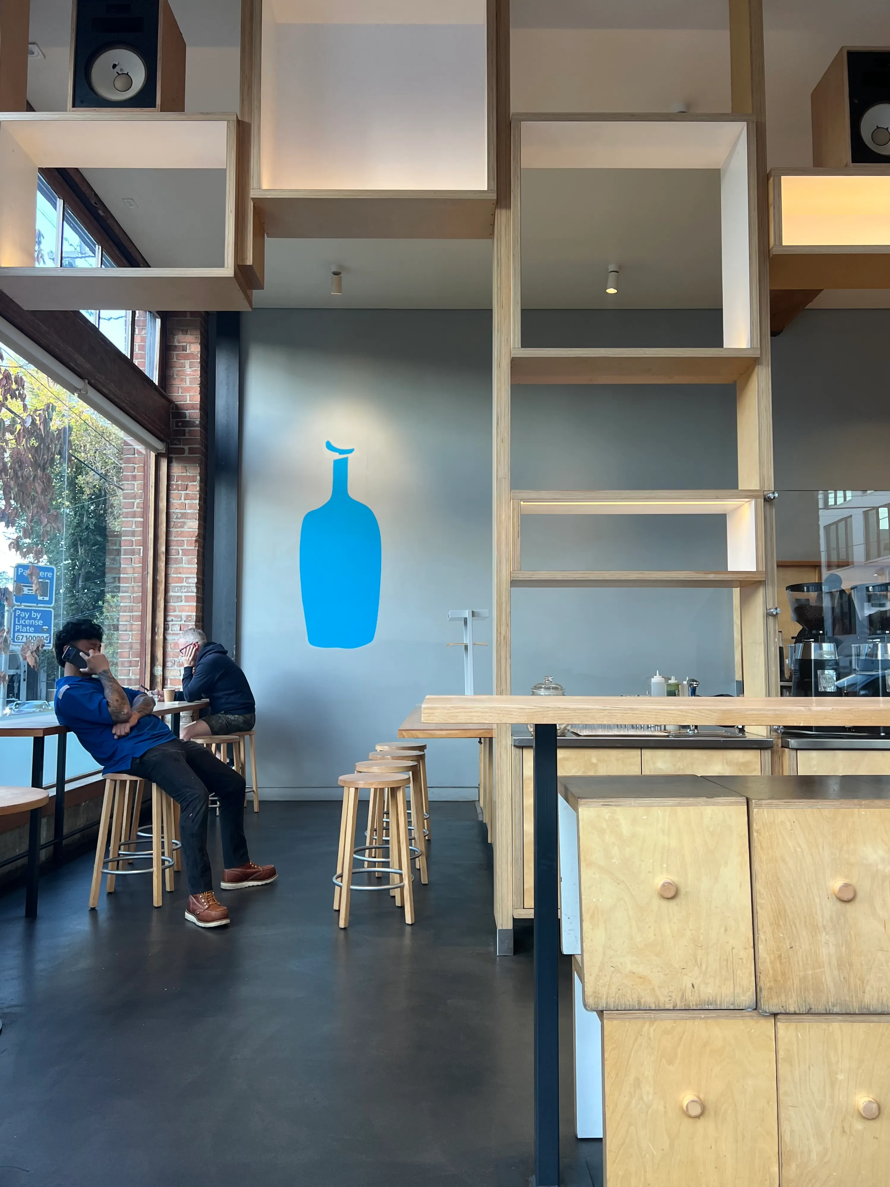 Inside a bright Blue Bottle café.