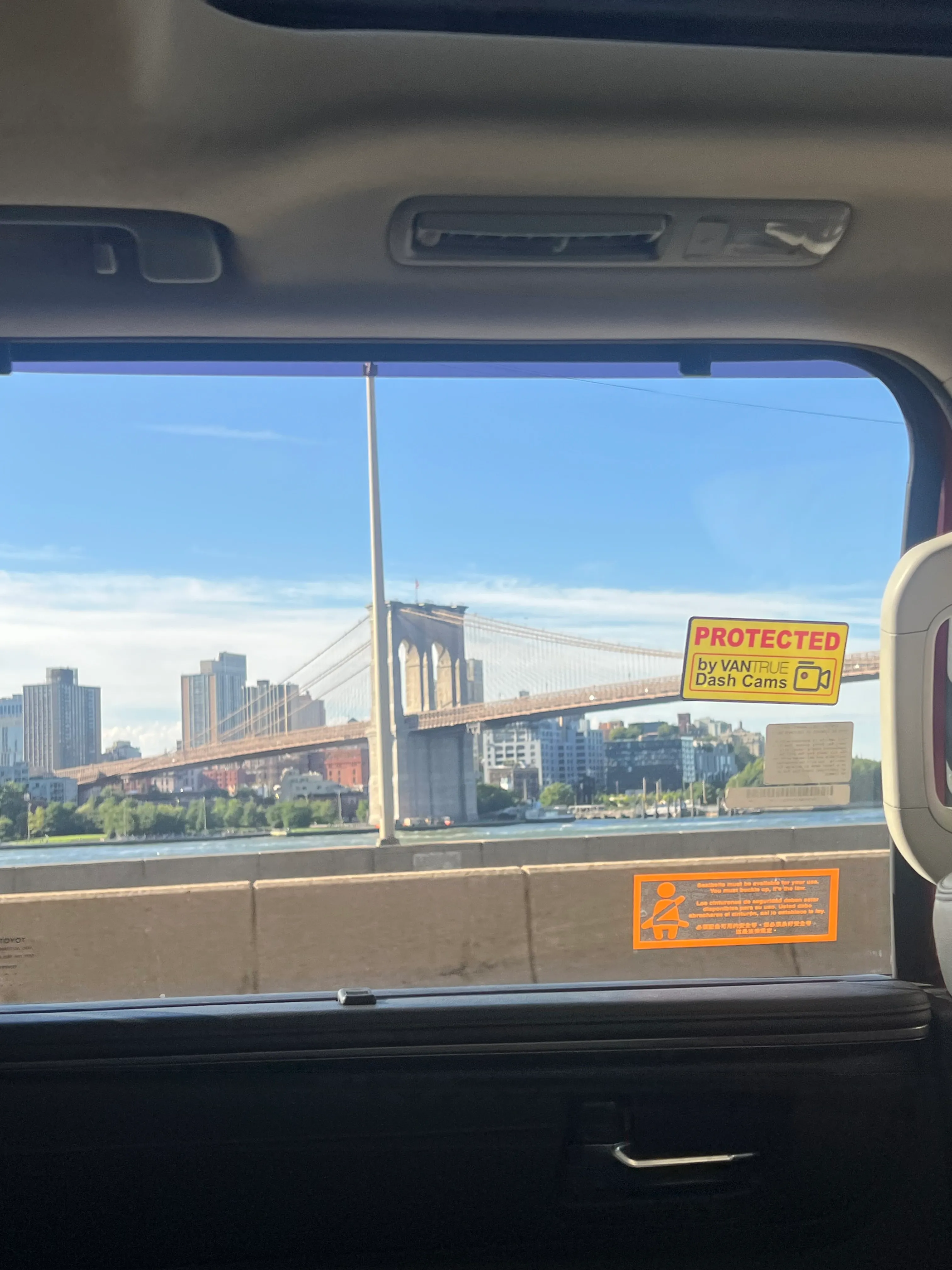 A bridge seen through the window of a vehicle.